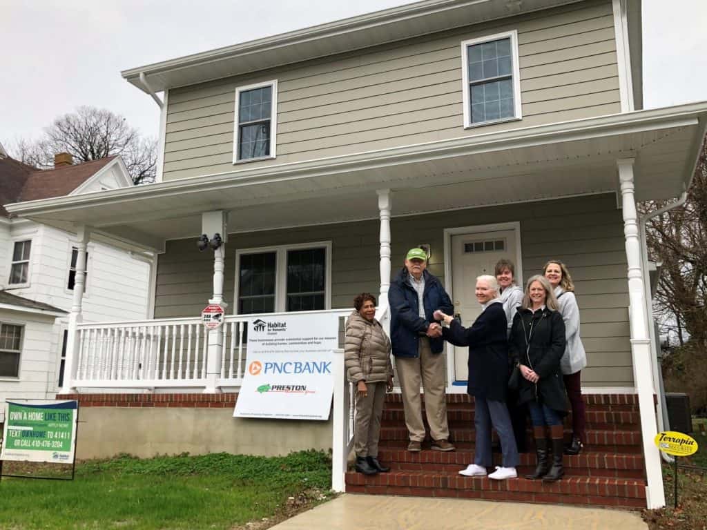 Pictured here are Barbara Hubbard, Julia Moore, and Laurie Cowin (in front) from the Waddell Foundation presenting the donation check to George Fox, JoAnn Hansen and Jenny Schmidt (in back) from Habitat for Humanity Choptank at one of the homes built by Habitat Choptank on High Street in downtown Cambridge. Photo taken in February.